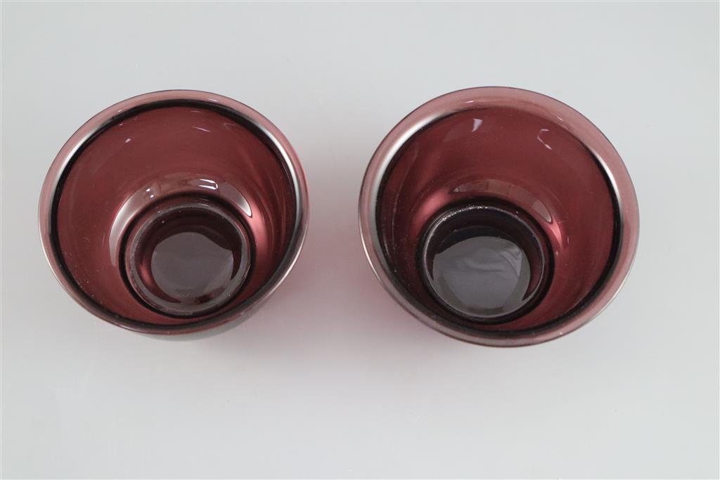 A pair of Chinese Beijing aubergine glass bowls, probably Qing dynasty, 10.5cm diameter